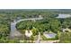 Aerial view of neighborhood, showcasing lakefront property with beach access and a community pool at 890 Lake Dr, Snellville, GA 30039