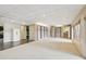 Expansive basement with tile and carpet floors, built-in shelving, and ample storage at 890 Lake Dr, Snellville, GA 30039