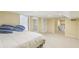 Spacious basement bedroom featuring large walk-in closet and adjacent built-in shelving at 890 Lake Dr, Snellville, GA 30039