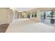 Large basement featuring built-in shelving, tile floors, and walkout access at 890 Lake Dr, Snellville, GA 30039