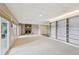 Spacious basement with cozy fireplace and built-in bookshelves for storage at 890 Lake Dr, Snellville, GA 30039