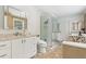Modern bathroom featuring a glass enclosed shower, granite counters and neutral tile floors at 890 Lake Dr, Snellville, GA 30039