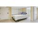 Bedroom featuring a bed with striped pillows, built-in shelving, and ample space at 890 Lake Dr, Snellville, GA 30039