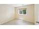 Bright, windowed bedroom with neutral paint and trim at 890 Lake Dr, Snellville, GA 30039
