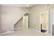 Cozy bedroom features neutral walls, carpet, and door leading to a bathroom at 890 Lake Dr, Snellville, GA 30039