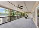 Spacious covered porch featuring fan, lake view, and convenient access to the home's interior at 890 Lake Dr, Snellville, GA 30039