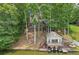 Stunning lake house with lush greenery, a boathouse, and a private dock perfect for waterfront living at 890 Lake Dr, Snellville, GA 30039