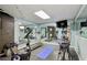 Fully equipped home gym with mirrors, exercise machines, and rubber flooring at 890 Lake Dr, Snellville, GA 30039