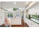 Bright and open kitchen flowing into the living area with an island and modern finishes at 890 Lake Dr, Snellville, GA 30039