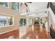 Spacious living room featuring hardwood floors, high ceilings, a fireplace, and sliding doors to the deck at 890 Lake Dr, Snellville, GA 30039