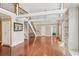 Expansive living area with hardwood floors, a staircase, and built-in shelving offering a comfortable and functional design at 890 Lake Dr, Snellville, GA 30039