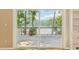 Sliding glass doors open to a patio with lake views, creating a serene indoor-outdoor living experience at 890 Lake Dr, Snellville, GA 30039