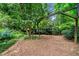 Backyard swing set surrounded by lush landscaping at 1138 Berkeley Rd, Avondale Estates, GA 30002