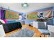 Charming bedroom with unique decor, hardwood floors, and abundant natural light at 1138 Berkeley Rd, Avondale Estates, GA 30002