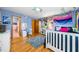 Bright, colorful bedroom with hardwood floors, study area, and creative design elements at 1138 Berkeley Rd, Avondale Estates, GA 30002