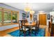 Elegant dining room with hardwood floors, large windows, and decorative light fixtures at 1138 Berkeley Rd, Avondale Estates, GA 30002