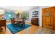 Charming dining area with hardwood floors, elegant lighting, and a window view at 1138 Berkeley Rd, Avondale Estates, GA 30002