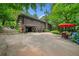 Rear exterior view of home featuring an outdoor lounge area and lush landscaping at 1138 Berkeley Rd, Avondale Estates, GA 30002