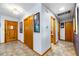 Inviting foyer with tile flooring, chandelier, and multiple closets for ample storage at 1138 Berkeley Rd, Avondale Estates, GA 30002