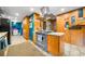 Spacious kitchen boasting a center island, stainless appliances, and decorative wood paneling at 1138 Berkeley Rd, Avondale Estates, GA 30002