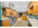 Spacious kitchen with stainless steel appliances and custom wooden cabinets at 1138 Berkeley Rd, Avondale Estates, GA 30002