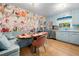 Bright kitchen featuring stainless appliances, built-in bench seating and floral wallpaper at 1138 Berkeley Rd, Avondale Estates, GA 30002