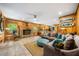 Warm and inviting living room featuring a brick fireplace, comfortable sofa, and hardwood floors at 1138 Berkeley Rd, Avondale Estates, GA 30002