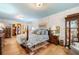 Cozy main bedroom featuring hardwood floors, a walk-in closet, and a soothing color scheme at 1138 Berkeley Rd, Avondale Estates, GA 30002