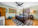 Serene main bedroom featuring natural light, hardwood floors, and ceiling fan at 1138 Berkeley Rd, Avondale Estates, GA 30002