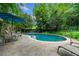 Backyard swimming pool with surrounding patio and lounge chairs at 1138 Berkeley Rd, Avondale Estates, GA 30002