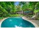 Backyard view featuring a swimming pool and an outdoor lounge area at 1138 Berkeley Rd, Avondale Estates, GA 30002