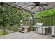 Back deck with built-in grill and barbecue perfect for outdoor cooking and entertaining at 1371 N Highland Ne Ave, Atlanta, GA 30306