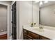 Bathroom featuring a vanity with dark cabinets, a modern sink and hardware at 1371 N Highland Ne Ave, Atlanta, GA 30306