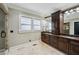 Elegant bathroom with a double vanity, granite countertops, and a separate glass-enclosed shower at 1371 N Highland Ne Ave, Atlanta, GA 30306