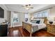 Inviting bedroom with hardwood floors, natural light, and comfortable bedding at 1371 N Highland Ne Ave, Atlanta, GA 30306