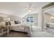 Cozy bedroom with soft natural light, neutral colors, and a view of an ensuite bath for convenience at 1371 N Highland Ne Ave, Atlanta, GA 30306
