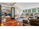 Versatile bonus room with wood floors, a built-in bench, and access to another room, perfect for entertaining at 1371 N Highland Ne Ave, Atlanta, GA 30306