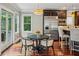 Bright eat-in kitchen features stainless steel appliances and a cozy breakfast nook at 1371 N Highland Ne Ave, Atlanta, GA 30306