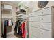 Walk-in closet features built-in shelves, hanging racks, and drawer storage at 1371 N Highland Ne Ave, Atlanta, GA 30306