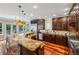 Well-equipped kitchen with granite countertops, stainless steel appliances, a breakfast bar, and hardwood floors at 1371 N Highland Ne Ave, Atlanta, GA 30306