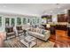 Open concept living room featuring hardwood floors and comfortable seating near the kitchen at 1371 N Highland Ne Ave, Atlanta, GA 30306