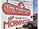 Exterior shot of The Gathering Dog mural with lettering, a dog graphic, and a parked car at 1371 N Highland Ne Ave, Atlanta, GA 30306