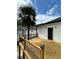 The back deck offers a charming view of the house and a sunny outdoor area with a tree at 1766 W Lyle W Ave, College Park, GA 30337