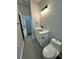 Bathroom features modern vanity, faucet, fixtures, and tile floors at 1766 W Lyle W Ave, College Park, GA 30337