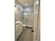 Stylish bathroom boasts a modern vanity, sleek fixtures, and a glass enclosed shower at 1766 W Lyle W Ave, College Park, GA 30337