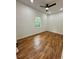 Bright, airy bedroom with hardwood floors, and a ceiling fan at 1766 W Lyle W Ave, College Park, GA 30337