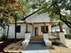 Charming front porch of a renovated home featuring wooden columns and a decorative railing at 1766 W Lyle W Ave, College Park, GA 30337