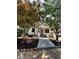 Inviting front yard of a renovated home with mature trees and a modern walkway leading to the entrance at 1766 W Lyle W Ave, College Park, GA 30337