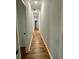 Hallway with hardwood floors, neutral walls, and views of rooms at 1766 W Lyle W Ave, College Park, GA 30337