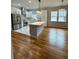 Contemporary kitchen with stainless steel appliances, quartz countertops, and pendant lighting at 1766 W Lyle W Ave, College Park, GA 30337